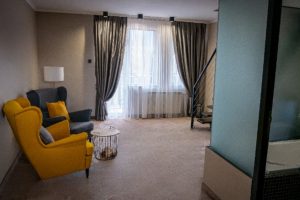 Seating corner in a room with yellow armchairs