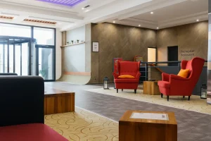 Red armchairs in the foyer